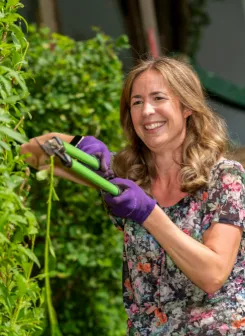 Picture of a person living with a severe disease gardening