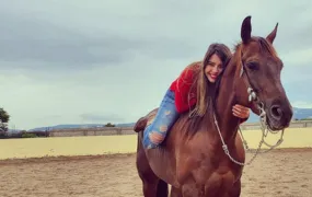 Picture of a person living with a severe disease horse-riding